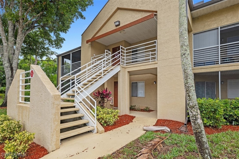View of property with stairs