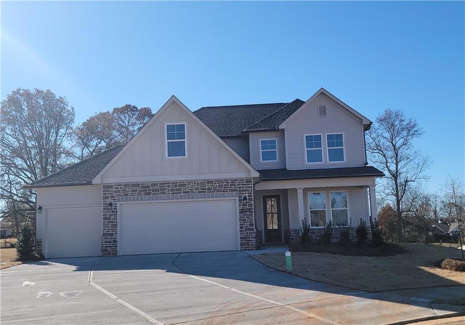 Craftsman inspired home featuring a garage
