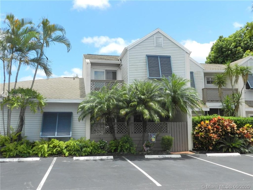 Exterior front with 2 assigned parking spaces