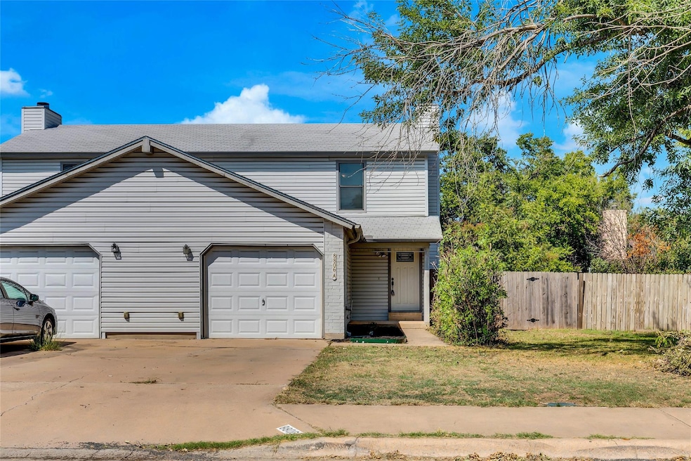 Traditional-style house featuring concrete drivew