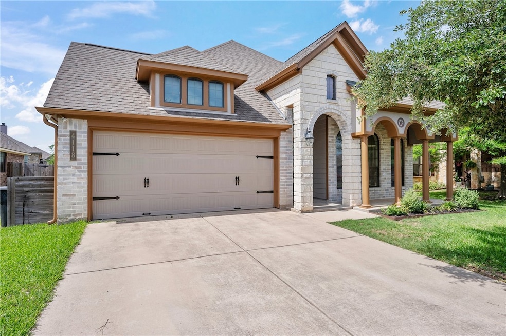 French country home featuring roof with shingles,