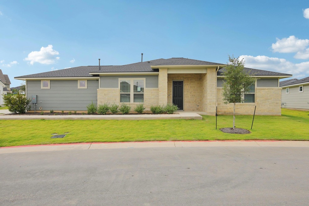 View of front of house featuring a front yard and roof with shingles