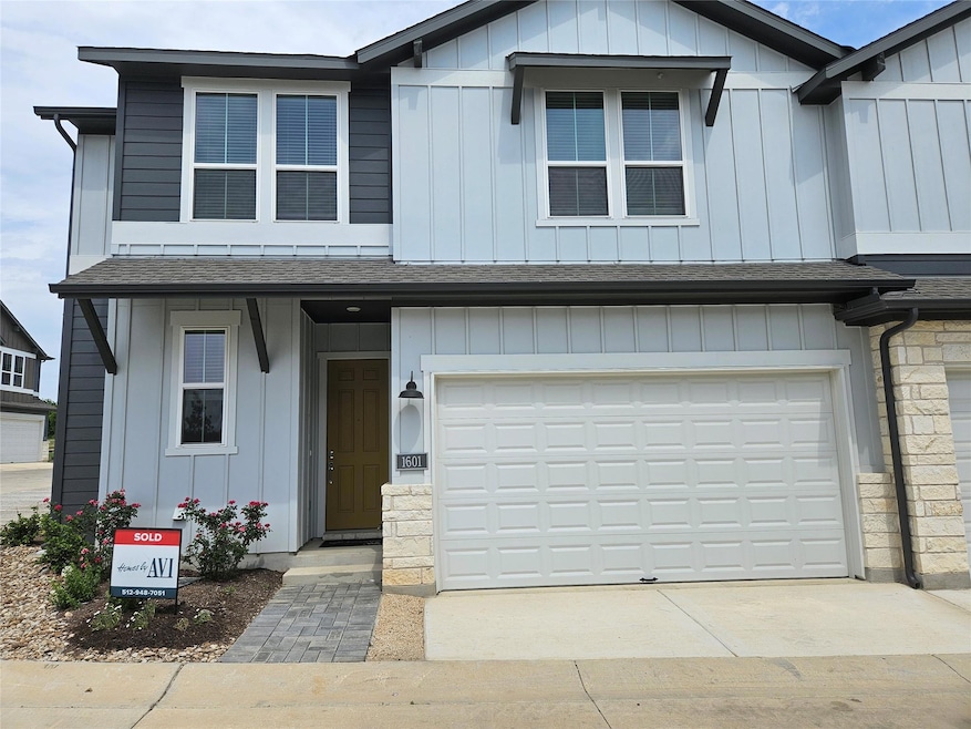 View of front of house with board and batten sidi