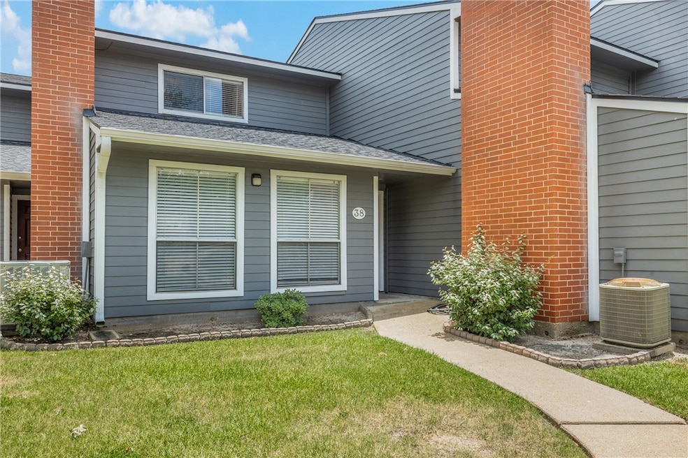 View of exterior entry with a yard