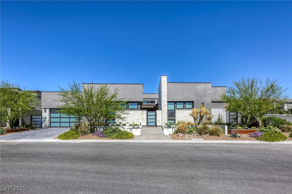 Contemporary home featuring stucco siding, an atta