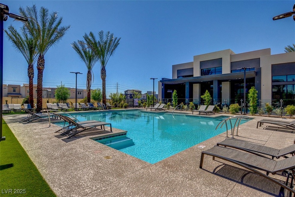 Community pool with a patio