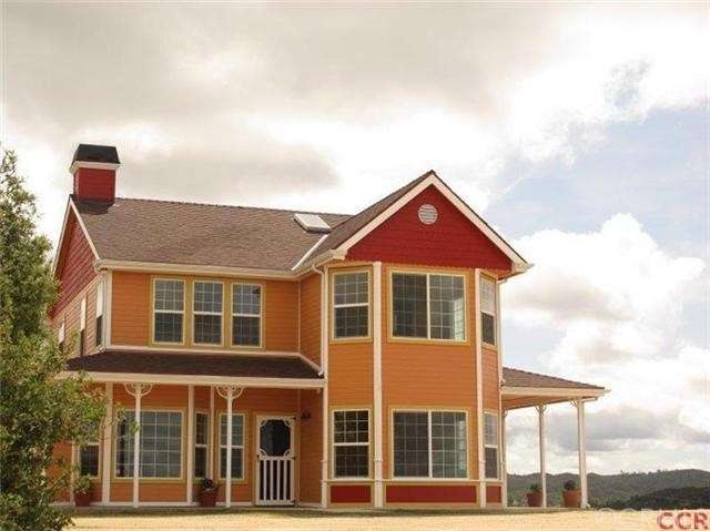 Captivating home with plenty of covered porch.