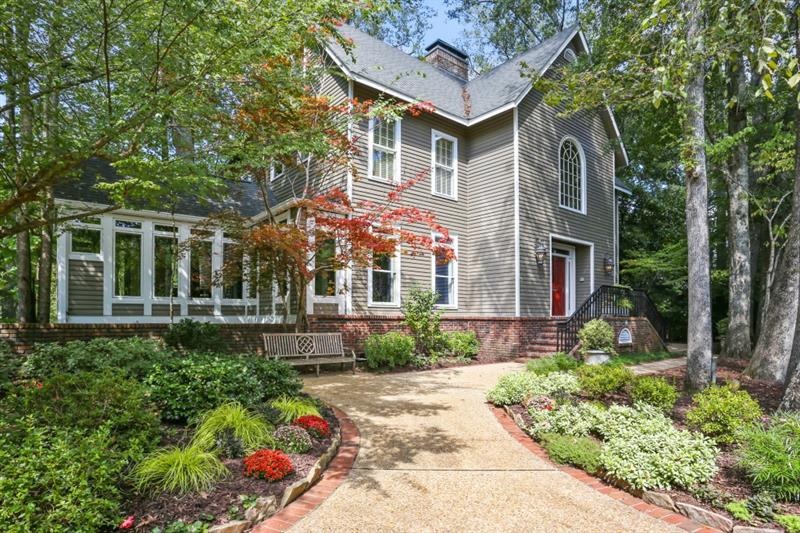This enchanting home on two lots totaling .61+/- a