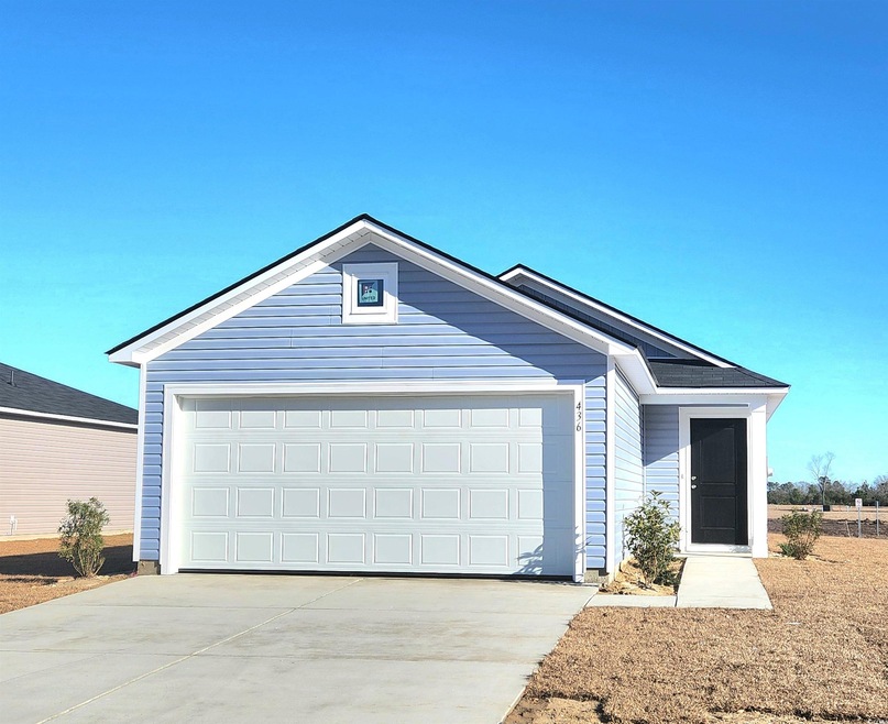 Ranch-style house featuring a garage
