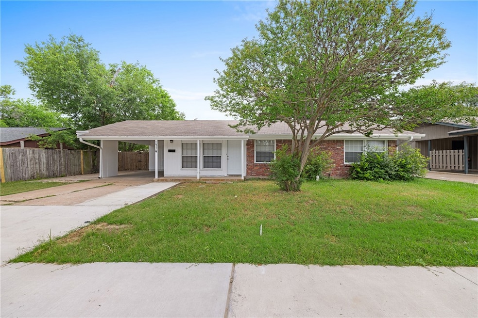 Ranch-style house with an attached carport and con