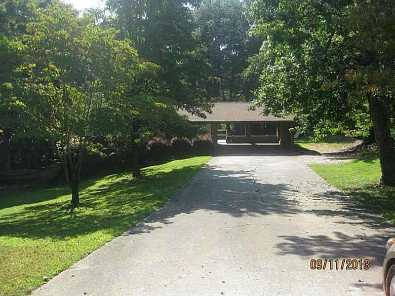 Exterior Front. The house is set back from the str