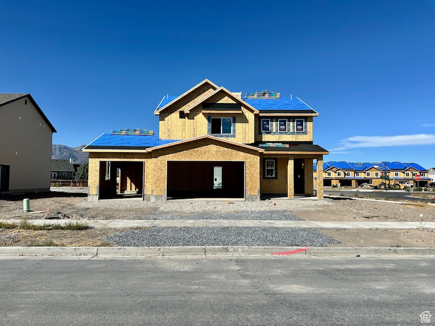 Property in mid-construction featuring a mountain view and a porch