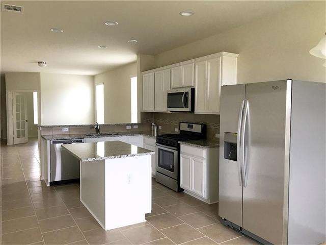 Lovely white kitchen, great island for food prep a