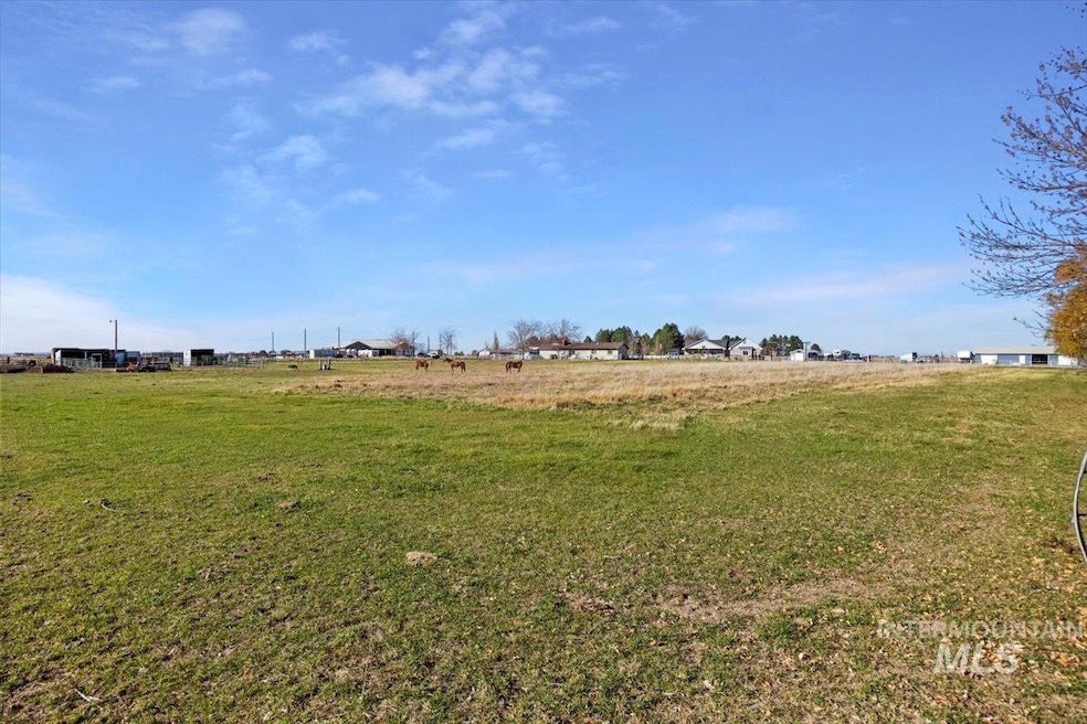 View of green lawn with a view of rural / pastoral area