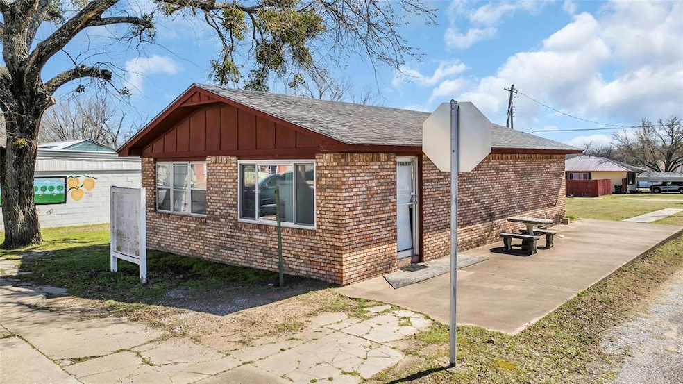 View of home's exterior with a patio, brick siding