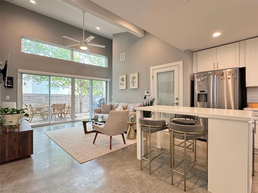 Kitchen featuring stainless steel fridge with ice