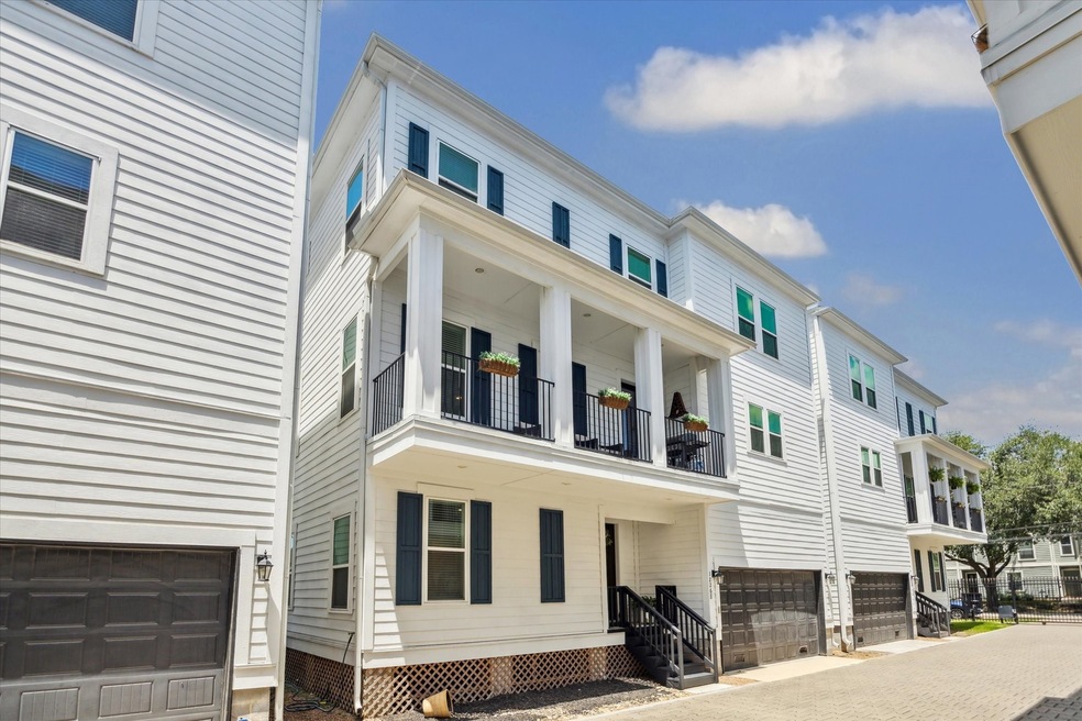 Fabulous townhouse with a sleek white exterior and