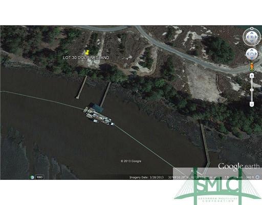 Exterior Front. Lot 30 Dolphin Island with mostly 