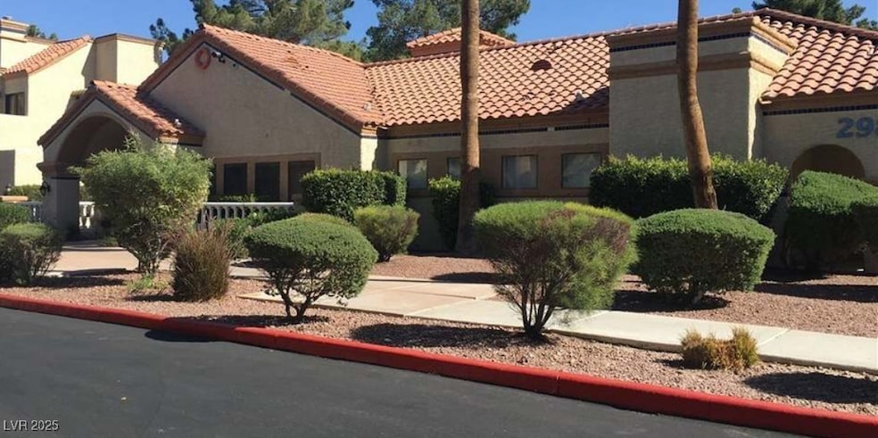 Mediterranean / spanish-style house featuring a ti