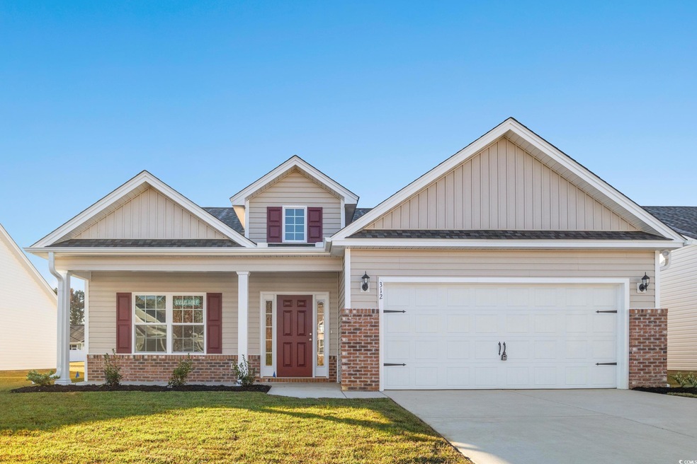 Craftsman house featuring a garage and a front law
