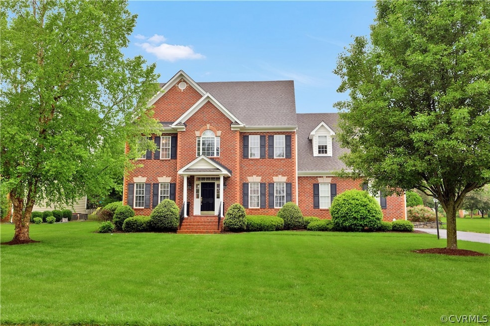 Front view of home from street.  Sits beautifully on large, grassy, flat lot.