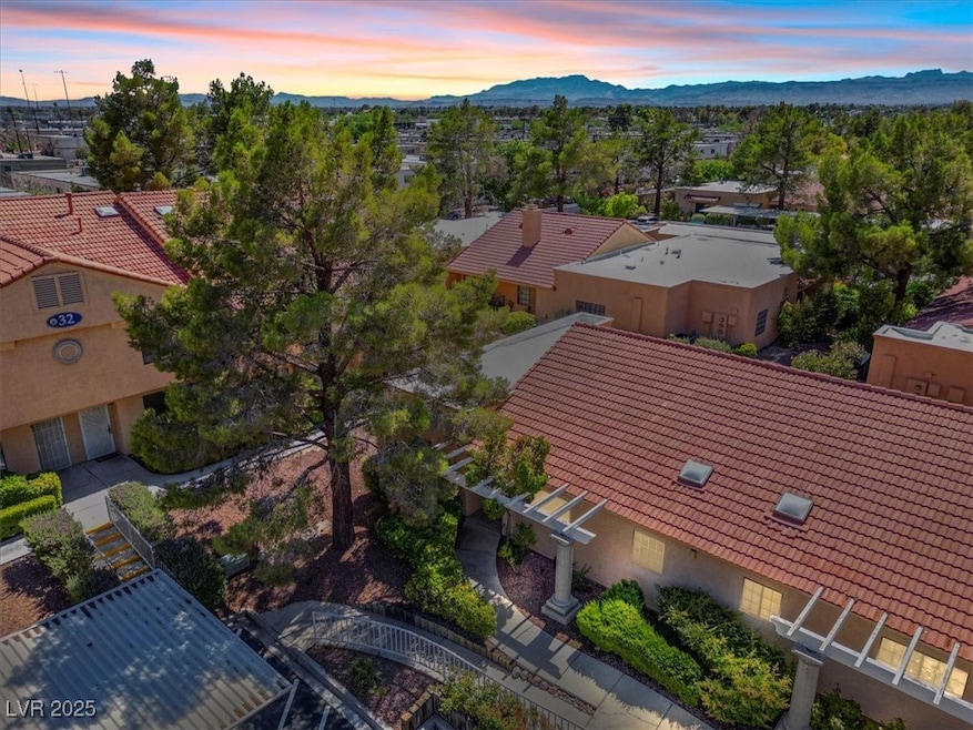 View from above of property, view of front of the home, featuring a mountainous background