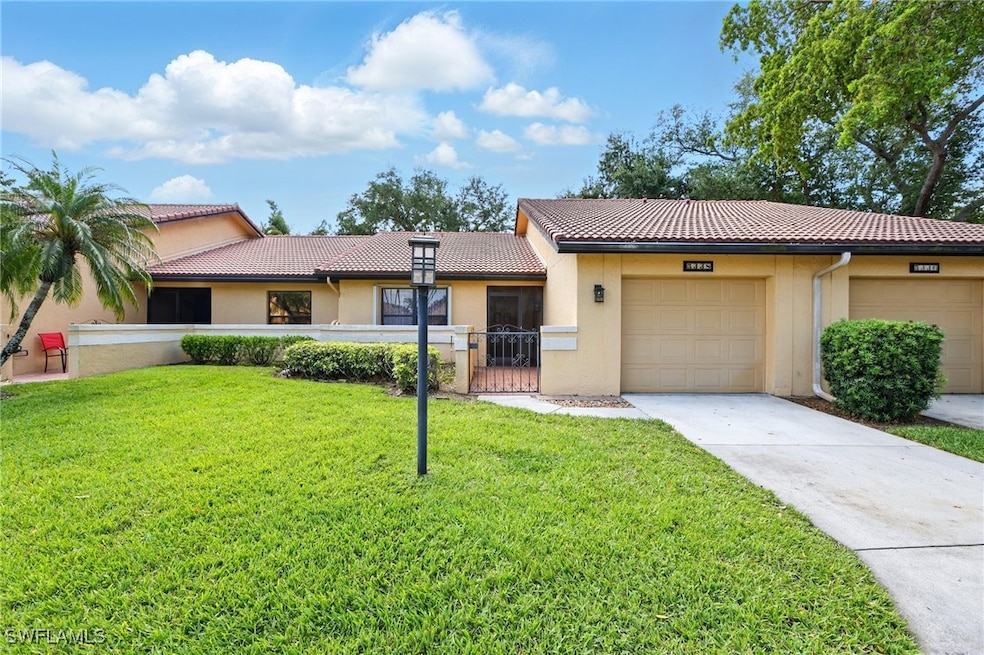 Single story home with a garage, stucco siding, a