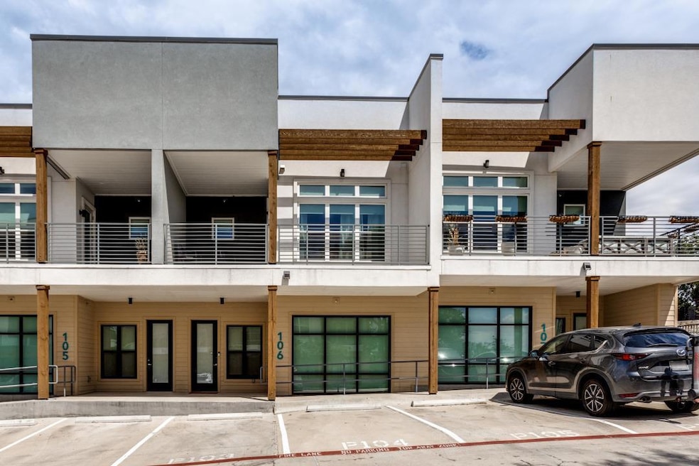 View of property with uncovered parking