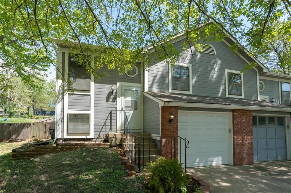 Welcome home to this sharp half duplex in Merriam!