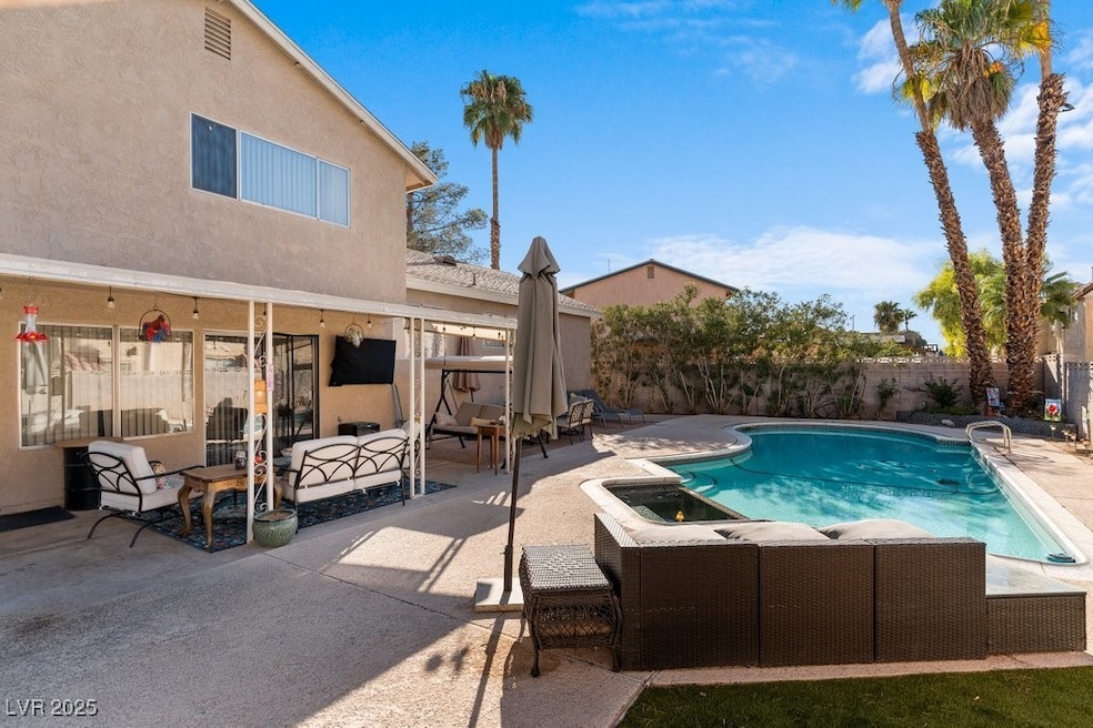 View of pool with outdoor lounge area, a fenced in