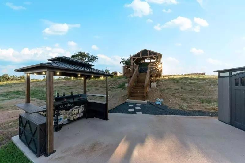 View of patio with a gazebo, grilling area, and s