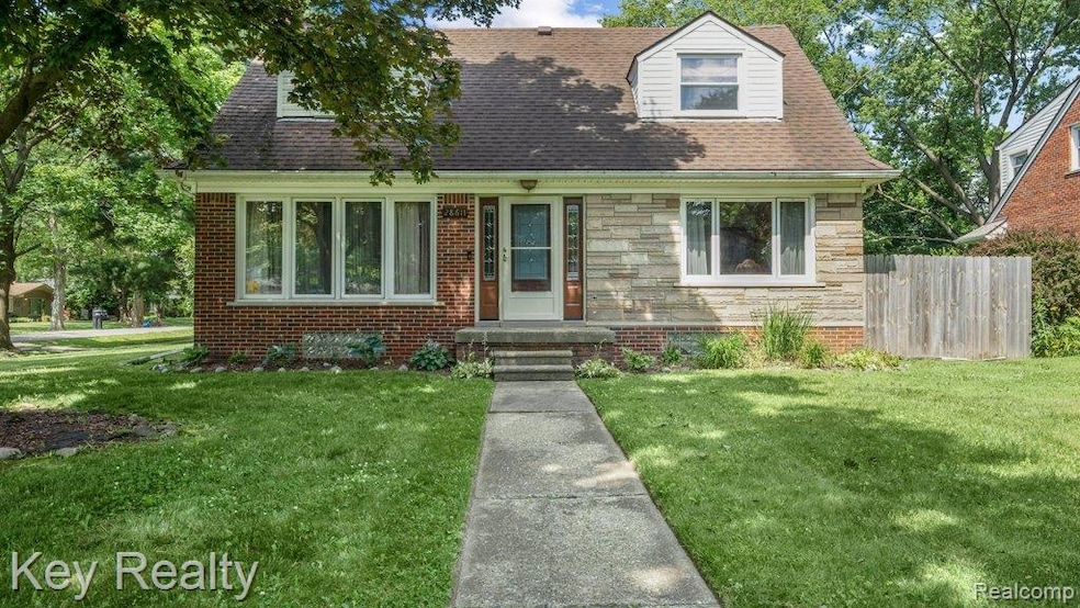 Classic brick colonial with welcoming porch and vinyl windows