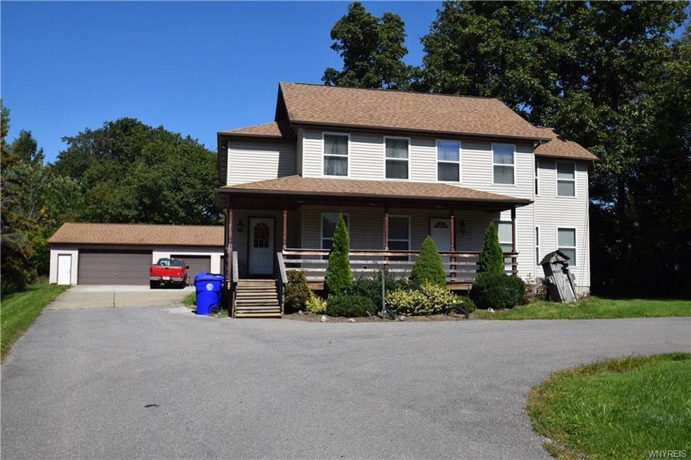 Front Elevation, detached 4 car garage and 