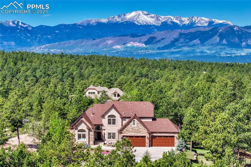 A stunning 2.91 acre home in the trees and a view!