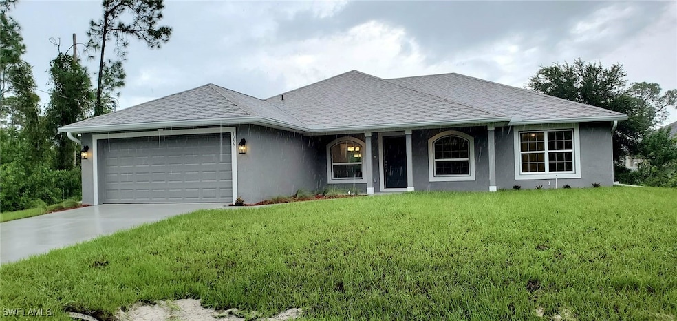 Ranch-style home featuring a garage and a front la