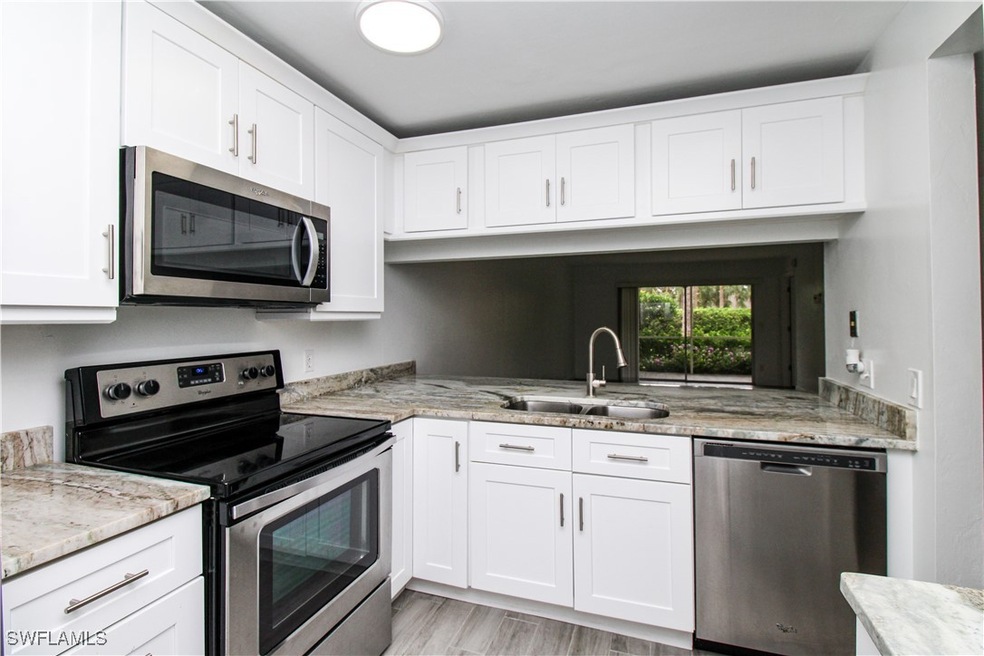 2566 Kings Lake Blvd unit 104, Naples, FL 34112 - photo 1