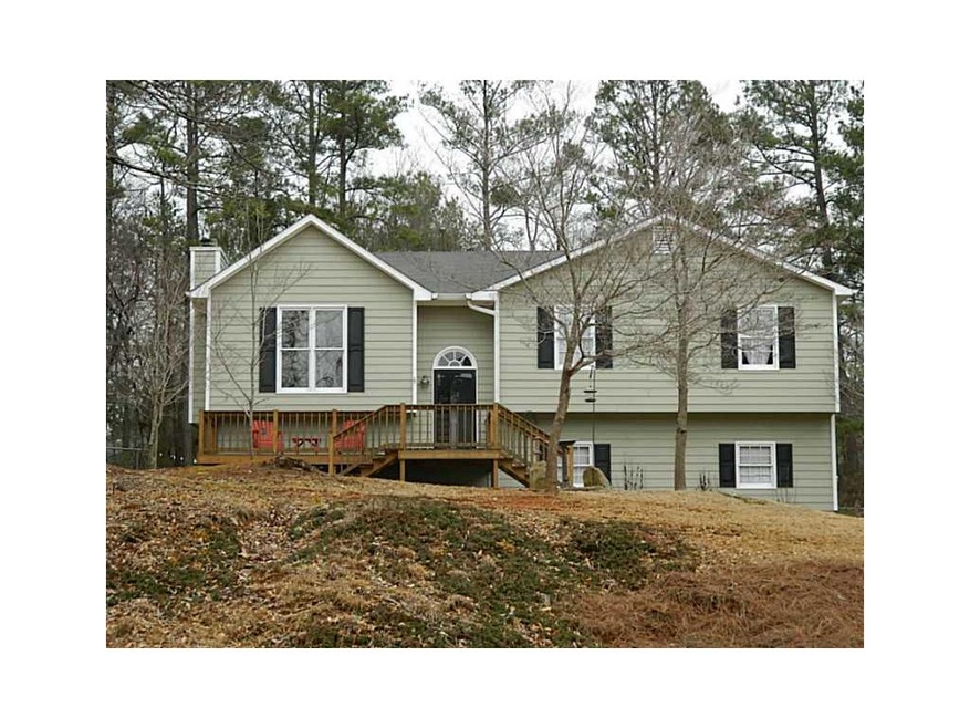 Exterior Front. Duel step front deck to home