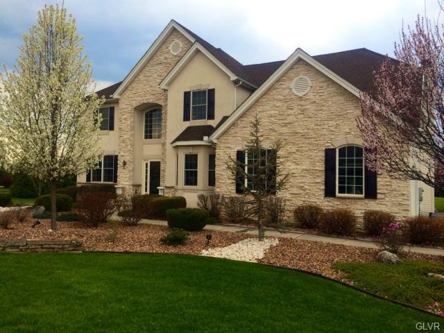 Stone and stucco with professional landscaping