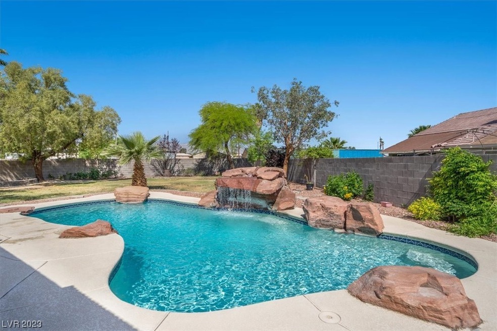 Refreshing Pool with Rock Waterfall Features perfe