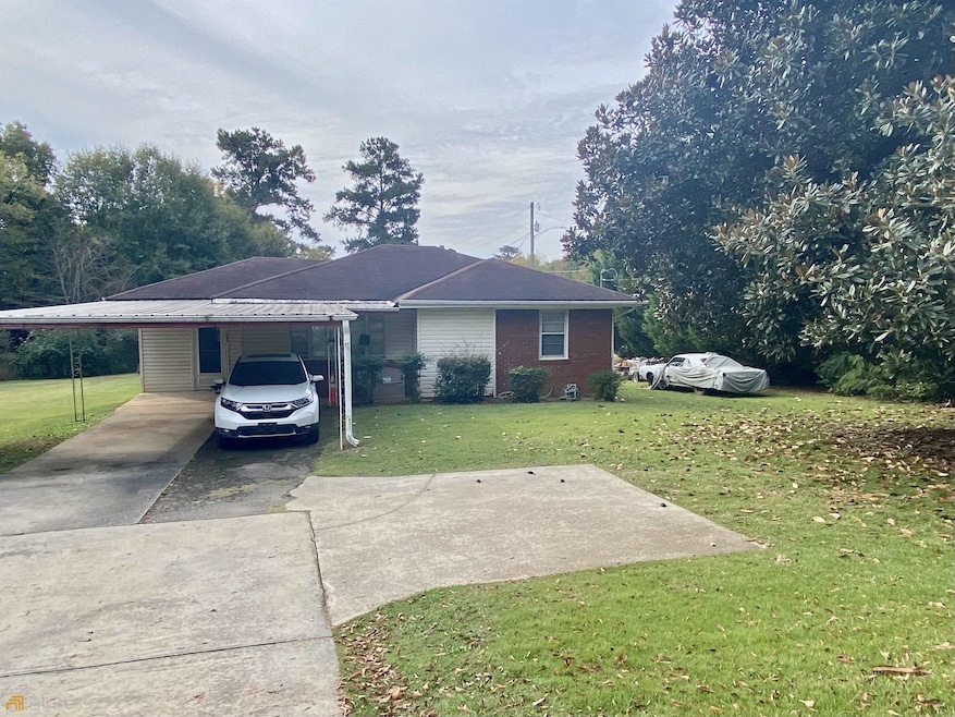 Parking pad, awning, and detached garage with 4 ba