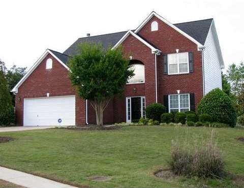 Exterior Front. Stunning brick traditional with le