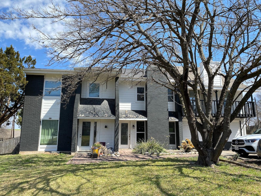 View of front of home featuring brick siding and 