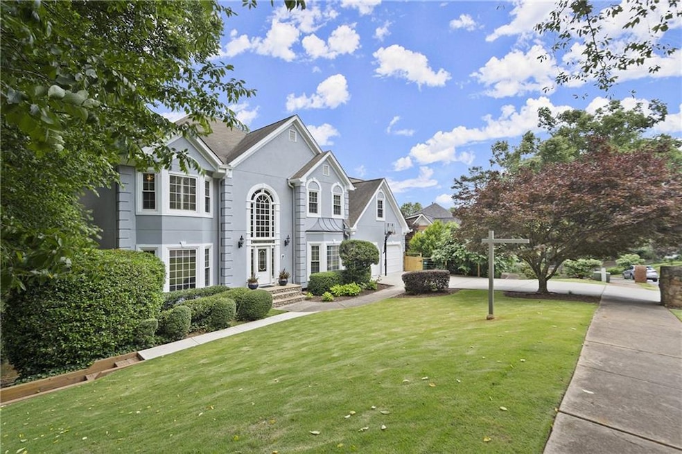 Level front yard and driveway, interior lake lot