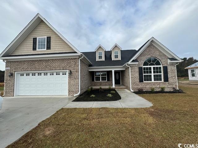 View of front of house featuring a garage and a fr