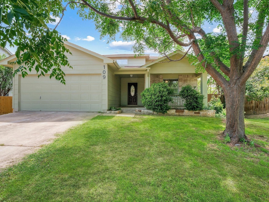 Ranch-style home featuring driveway, a garage, an