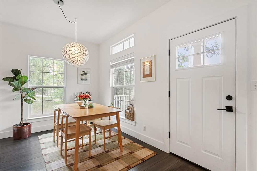 Dining space with baseboards and dark wood-style 