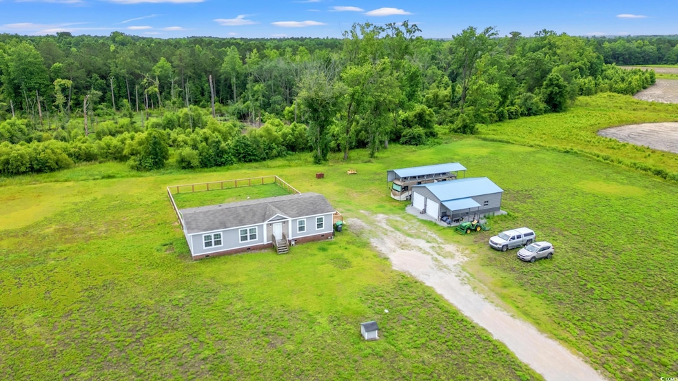 View from above of property with a heavily wooded area