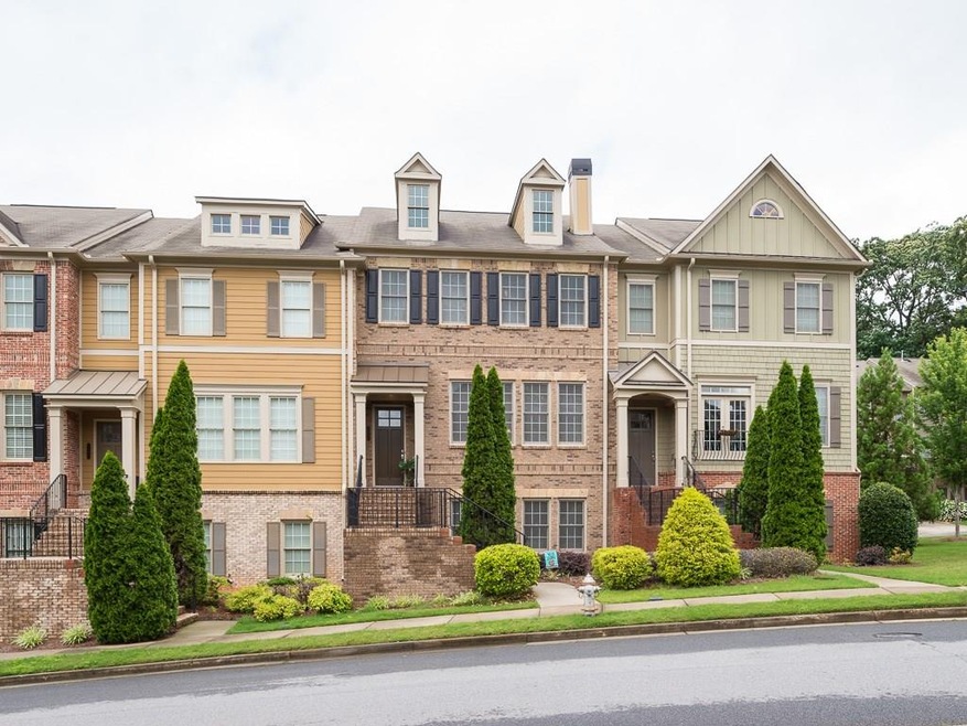 Beautiful tri-level townhome with brick facade