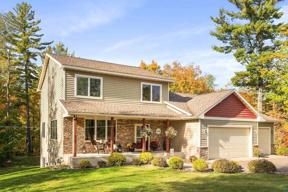 View of front of house with a front lawn, a porch,