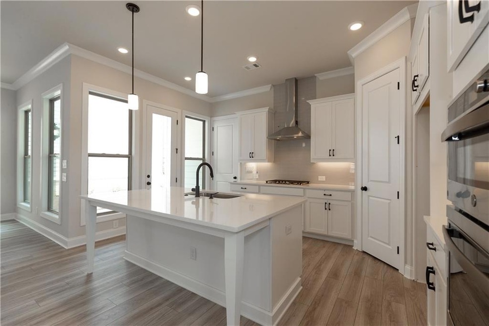 Beautiful cabinets, large island, quartz counterto